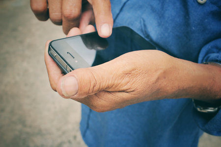 Senior man using smart phone