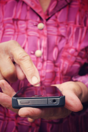 Senior using smart phone