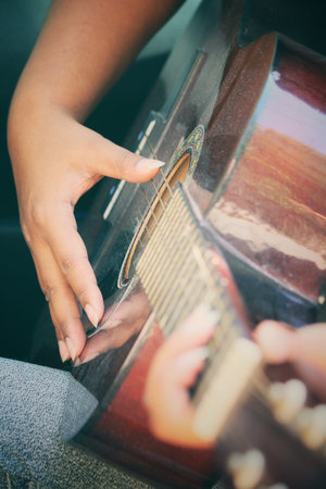 Woman playing the guitar