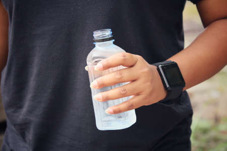 Drink water with smartwatchの写真素材