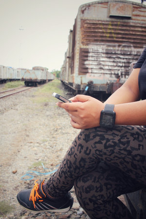 Woman using smart phone with smartwatch