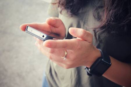 Woman using smart phoneの写真素材