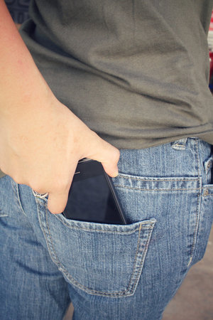 Smart phone in jeans pocket