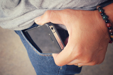Smart phone in jeans pocket