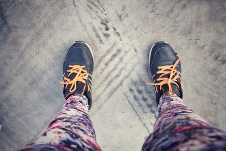 Selfie of sneakers with wheel tracks