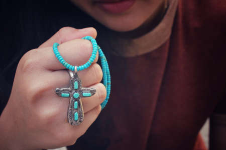 Hands praying with crossの写真素材