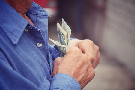 Senior man holding of dollarsの写真素材