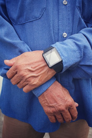 Senior man with smartwatchの写真素材