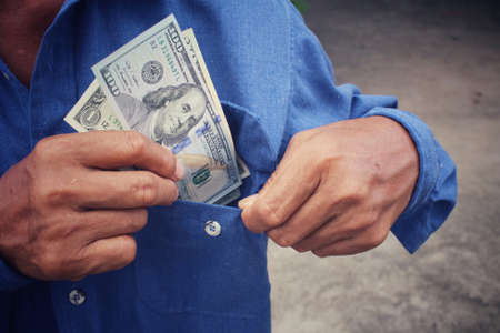 Senior man holding of dollarsの写真素材