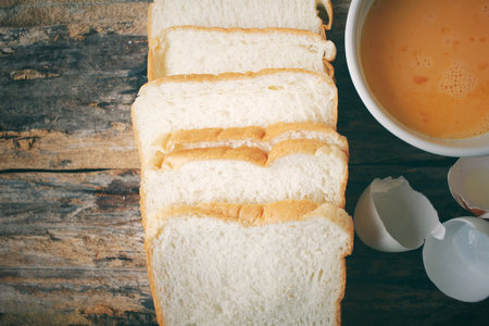 Eggs in a bowl with breadの写真素材