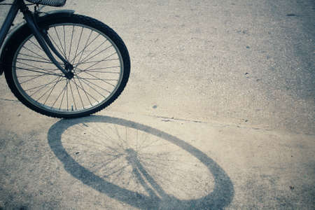 Vintage bicycle wheel with shadowの写真素材