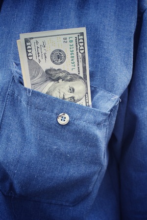 Dollars in jean pocketの写真素材