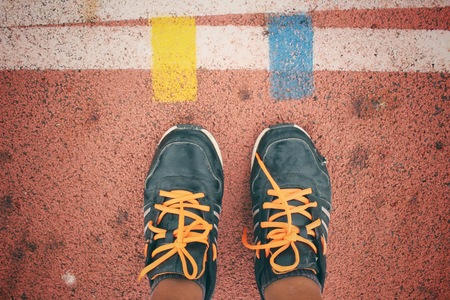 Selfie of sport shoes on trackの写真素材
