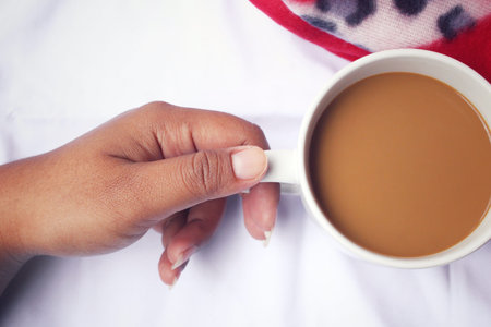 Drinking coffee on the bed