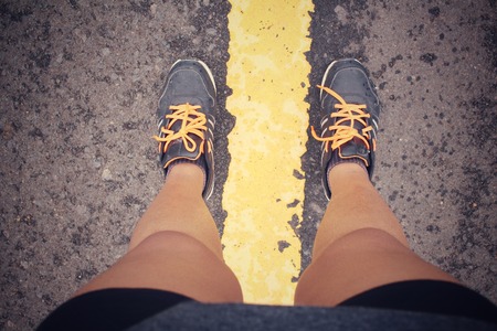 Selfie of sneakers on the roadの写真素材