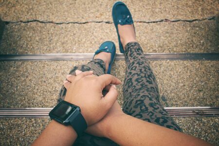 Woman sitting with smartwatchの写真素材