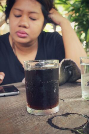 Woman with cola drinkの写真素材