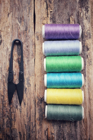 Bobbins colorful threads with scissors