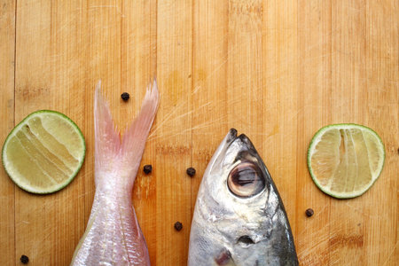 Fresh raw fish ,lemon and pepperの写真素材