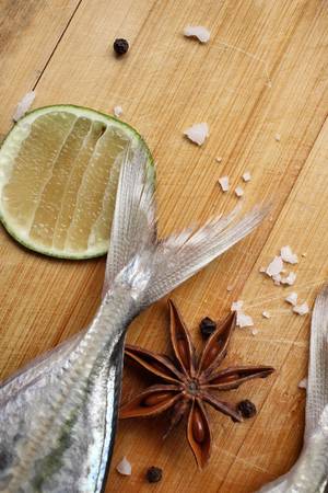 Fresh raw fish ,lemon ,salt ,star anise and pepperの写真素材
