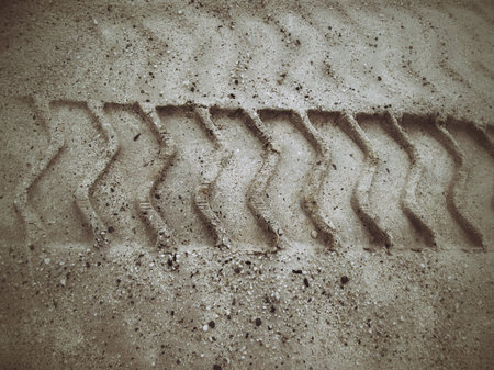 Wheel tracks on the soil.