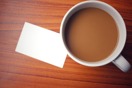 Coffee cup with blank business cardの写真素材