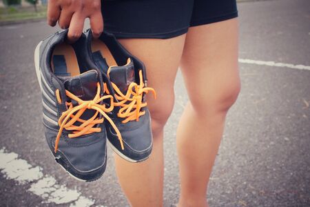 Woman with sports shoesの写真素材