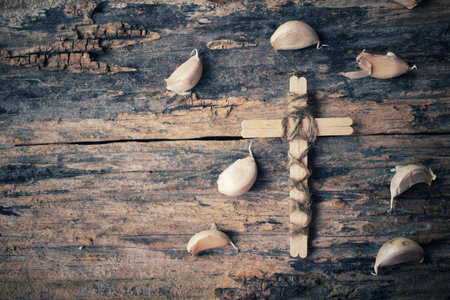 Vintage cross with garlicの写真素材