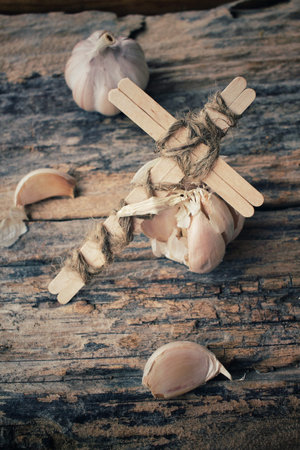 Vintage cross with garlicの写真素材