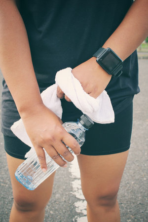 Sports set of smartwatch water drink and towel.