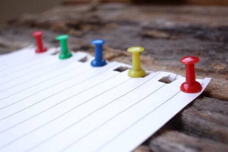 Paper notes with colorful push pinsの写真素材