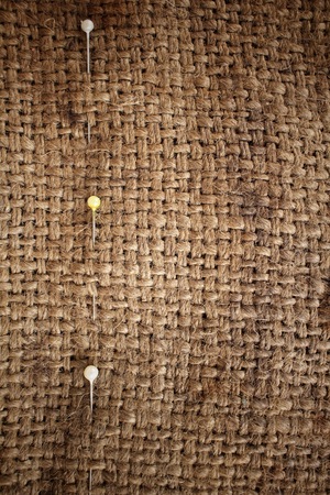 Sewing pins on sackclothの写真素材