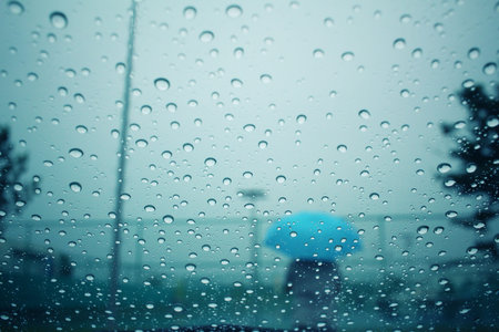 Blurred of water drop with umbrella