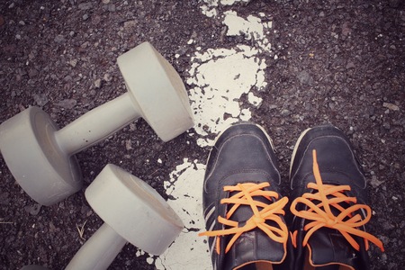 Sports set of sneakers with dumbbellの写真素材