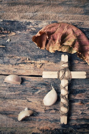 Vintage cross with garlicの写真素材