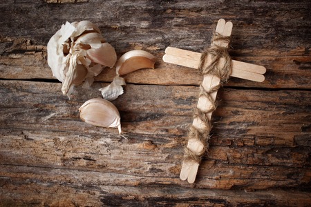 Vintage cross with garlicの写真素材