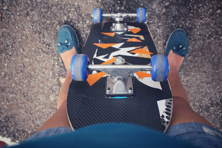 Selfie of young girl with skateboard