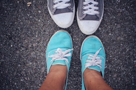 Selfie of sneakers with male and female couple