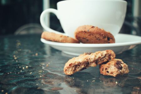Hot coffee with chocolate cookiesの写真素材