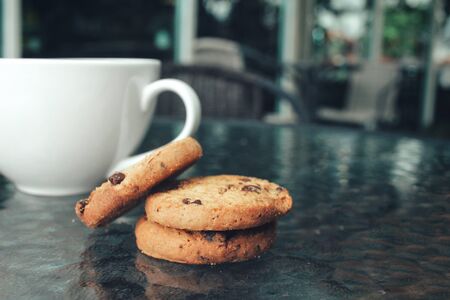 Hot coffee with chocolate cookiesの写真素材