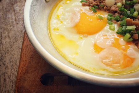 Breakfast with fried eggs on panの写真素材