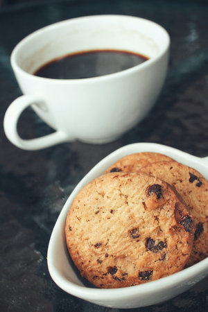 Hot coffee with chocolate cookiesの写真素材