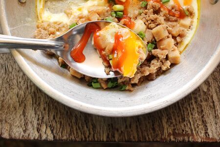 Breakfast with fried eggs on panの写真素材