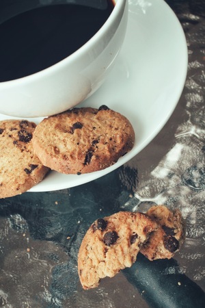 Hot coffee with chocolate cookiesの写真素材