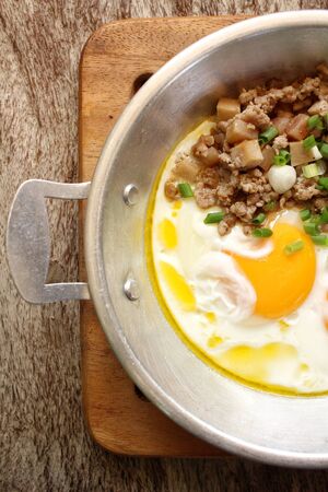 Breakfast with fried eggs on panの写真素材