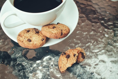 Hot coffee with chocolate cookiesの写真素材