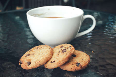 Hot coffee with chocolate cookiesの写真素材