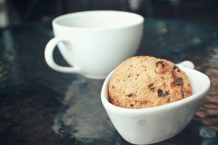 Hot coffee with chocolate cookiesの写真素材