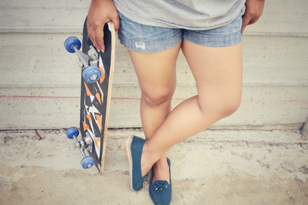 Young girl with skateboard