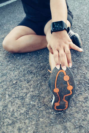 Woman exercises with smartwatchの写真素材